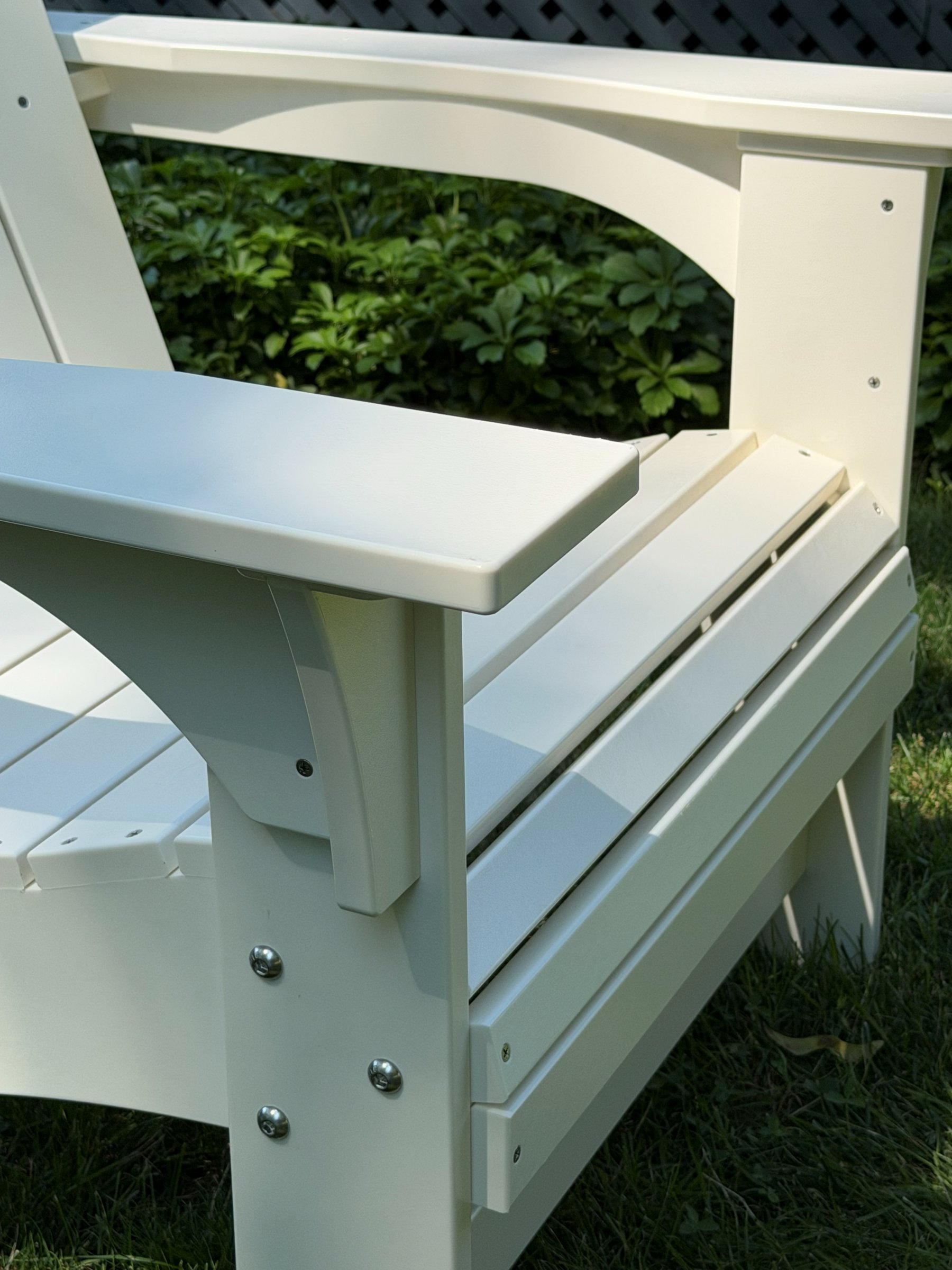 Detail of the Coastal Adirondack chair's arm joinery and stainless hardware