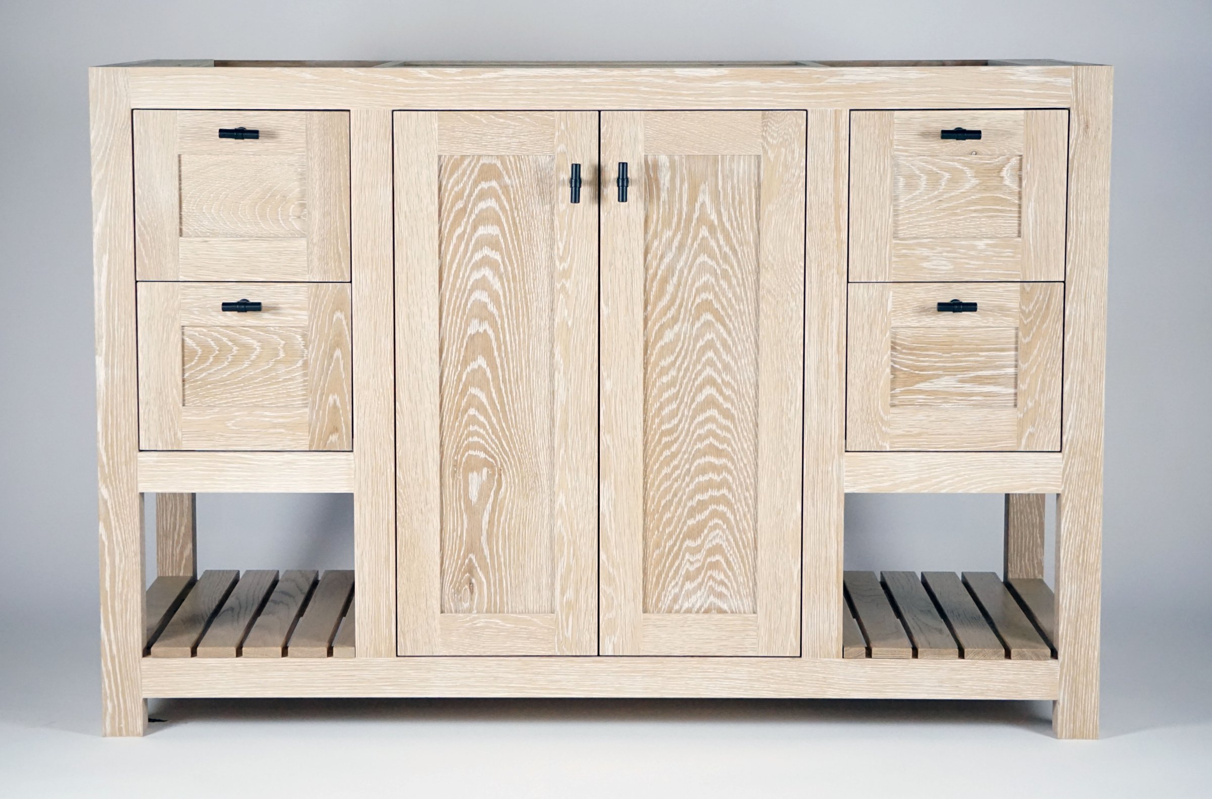 White oak bathroom vanity with black hardware