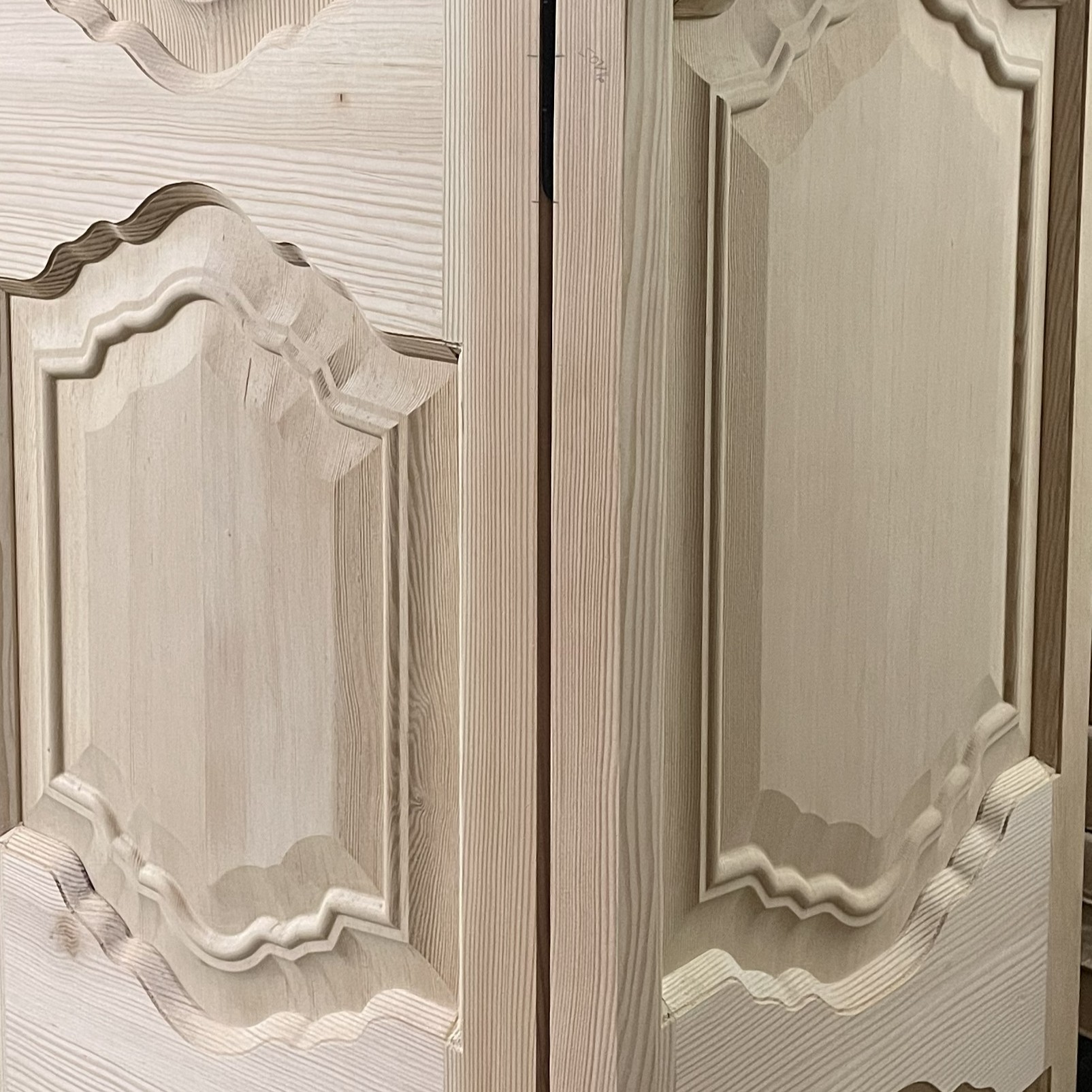 Close-up of a 3D carved raised-panel cabinet door