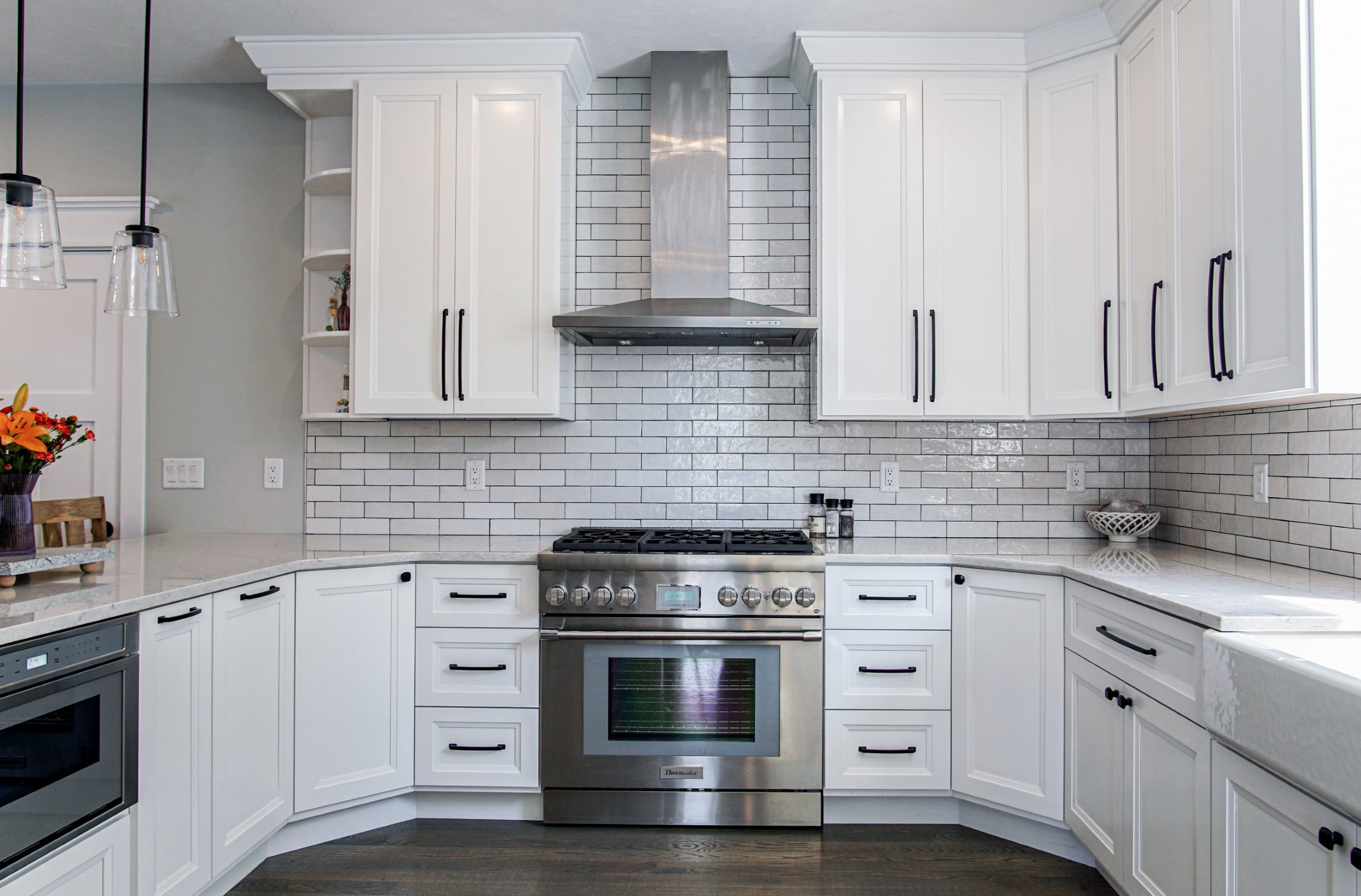 Painted kitchen with white shaker cabinets and subway tile backsplash